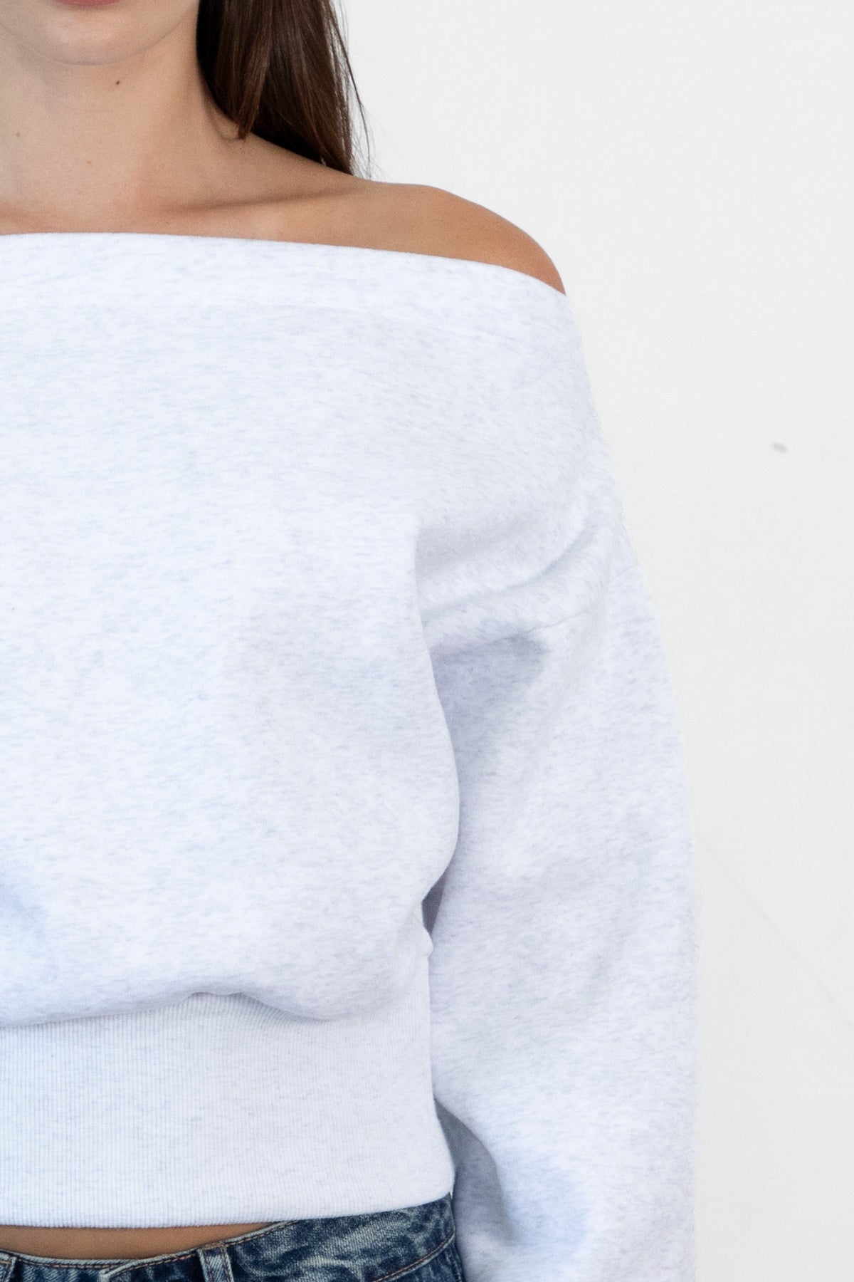 Woman wearing LANI mock neck cloud fleece sweatshirt featuring soft cotton blend cloud fleece fabric, ribbed mock neckline, relaxed oversized fit, dropped shoulder design, long sleeves with ribbed cuffs, triangle stitch detail at center front, and ribbed hem for a cozy comfortable finish.