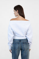 Woman wearing LANI mock neck cloud fleece sweatshirt featuring soft cotton blend cloud fleece fabric, ribbed mock neckline, relaxed oversized fit, dropped shoulder design, long sleeves with ribbed cuffs, triangle stitch detail at center front, and ribbed hem for a cozy comfortable finish.