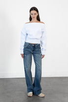 Woman wearing LANI mock neck cloud fleece sweatshirt featuring soft cotton blend cloud fleece fabric, ribbed mock neckline, relaxed oversized fit, dropped shoulder design, long sleeves with ribbed cuffs, triangle stitch detail at center front, and ribbed hem for a cozy comfortable finish.