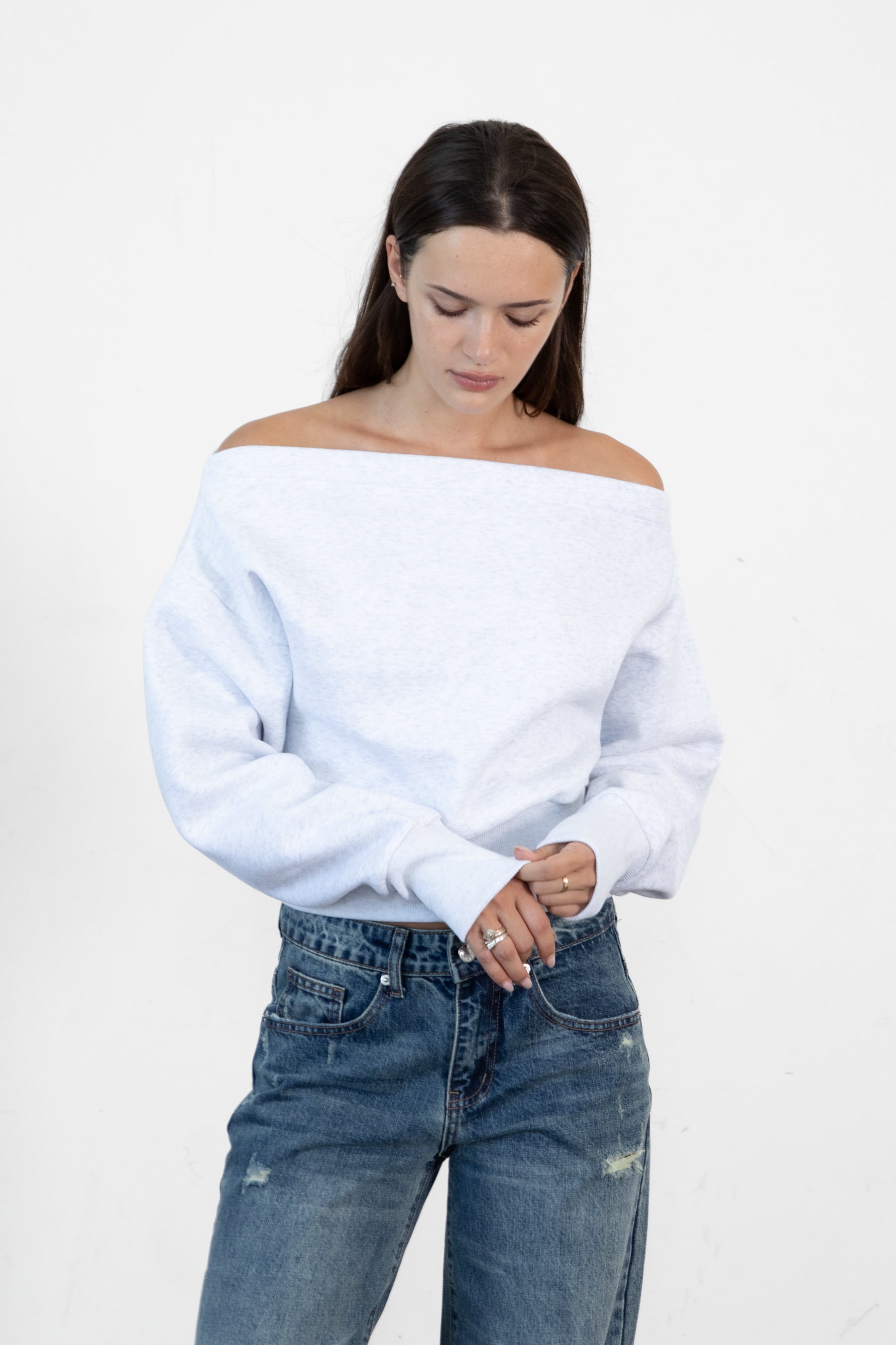 Woman wearing LANI mock neck cloud fleece sweatshirt featuring soft cotton blend cloud fleece fabric, ribbed mock neckline, relaxed oversized fit, dropped shoulder design, long sleeves with ribbed cuffs, triangle stitch detail at center front, and ribbed hem for a cozy comfortable finish.