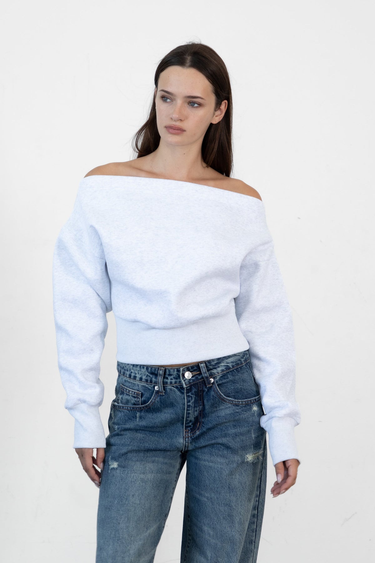 Woman wearing LANI mock neck cloud fleece sweatshirt featuring soft cotton blend cloud fleece fabric, ribbed mock neckline, relaxed oversized fit, dropped shoulder design, long sleeves with ribbed cuffs, triangle stitch detail at center front, and ribbed hem for a cozy comfortable finish.