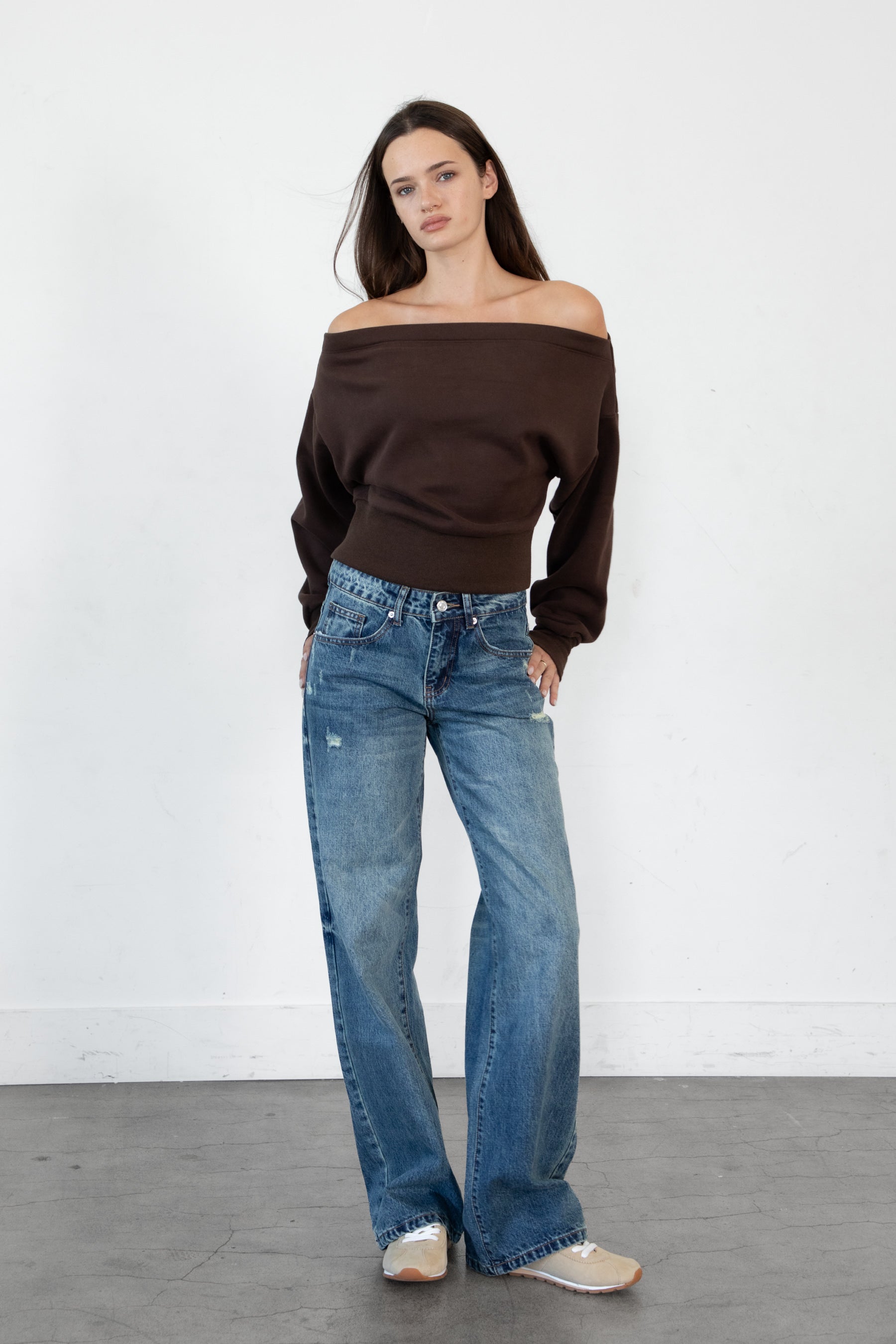 Woman wearing LANI mock neck cloud fleece sweatshirt featuring soft cotton blend cloud fleece fabric, ribbed mock neckline, relaxed oversized fit, dropped shoulder design, long sleeves with ribbed cuffs, triangle stitch detail at center front, and ribbed hem for a cozy comfortable finish.