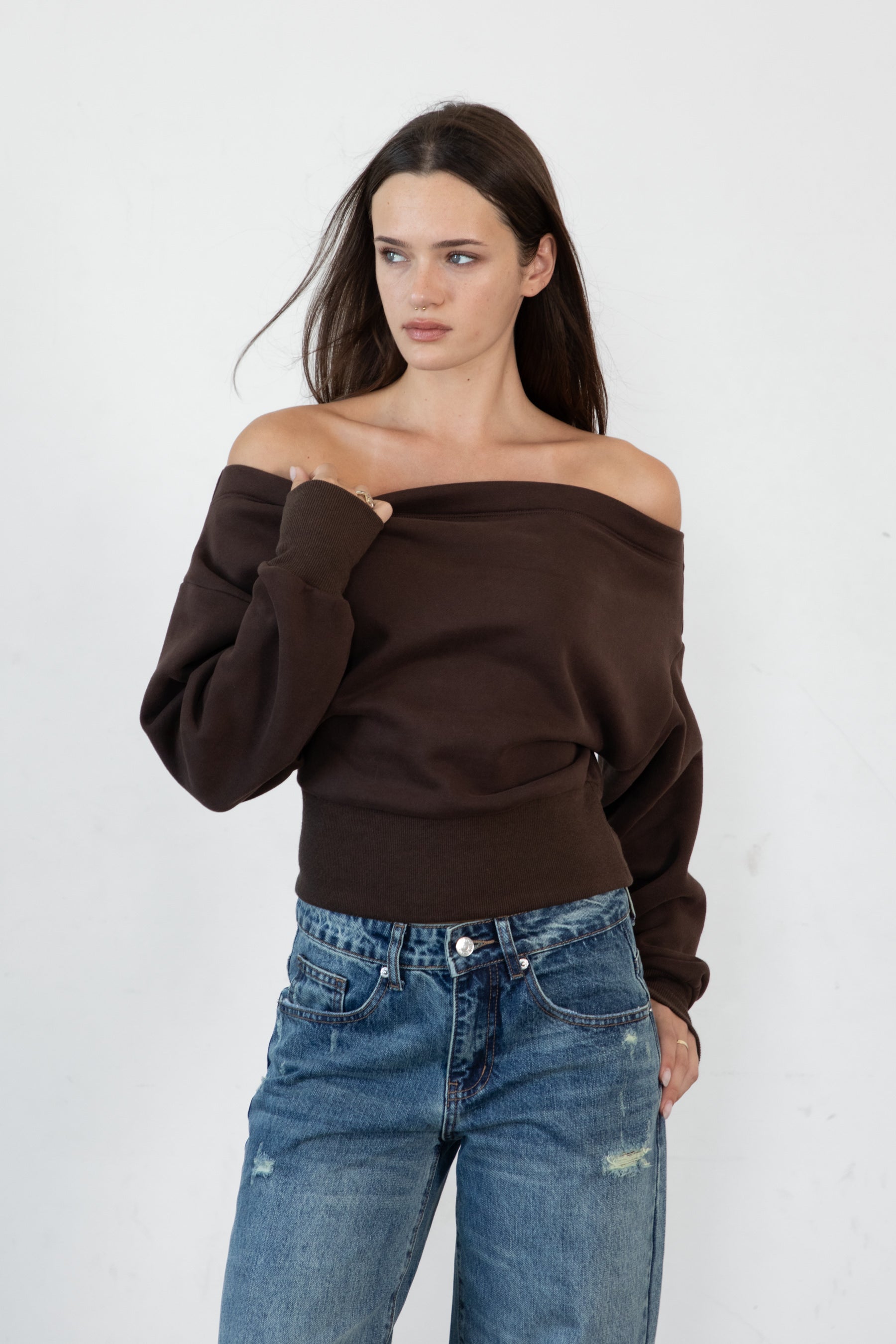 Woman wearing LANI mock neck cloud fleece sweatshirt featuring soft cotton blend cloud fleece fabric, ribbed mock neckline, relaxed oversized fit, dropped shoulder design, long sleeves with ribbed cuffs, triangle stitch detail at center front, and ribbed hem for a cozy comfortable finish.