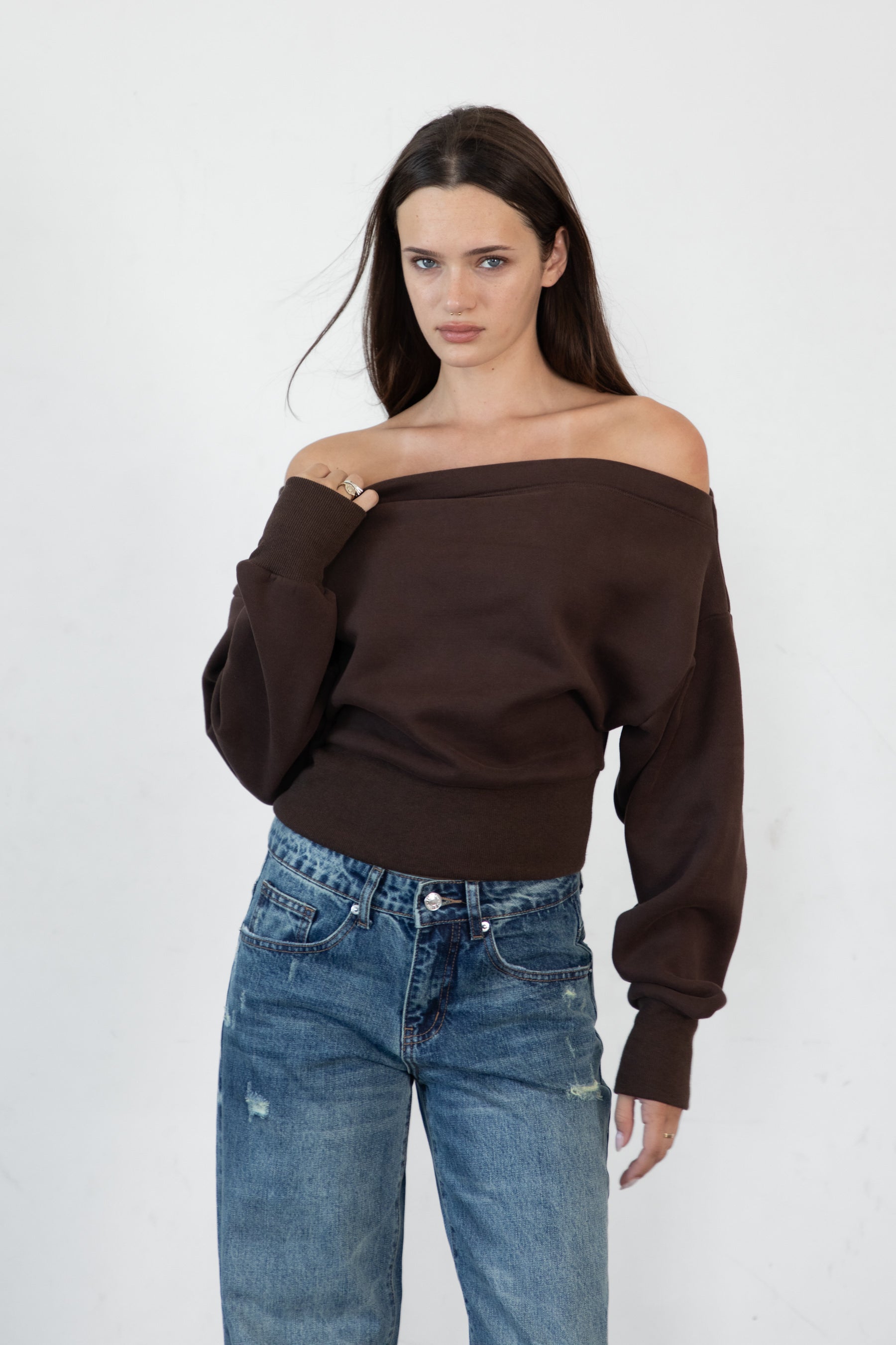 Woman wearing LANI mock neck cloud fleece sweatshirt featuring soft cotton blend cloud fleece fabric, ribbed mock neckline, relaxed oversized fit, dropped shoulder design, long sleeves with ribbed cuffs, triangle stitch detail at center front, and ribbed hem for a cozy comfortable finish.