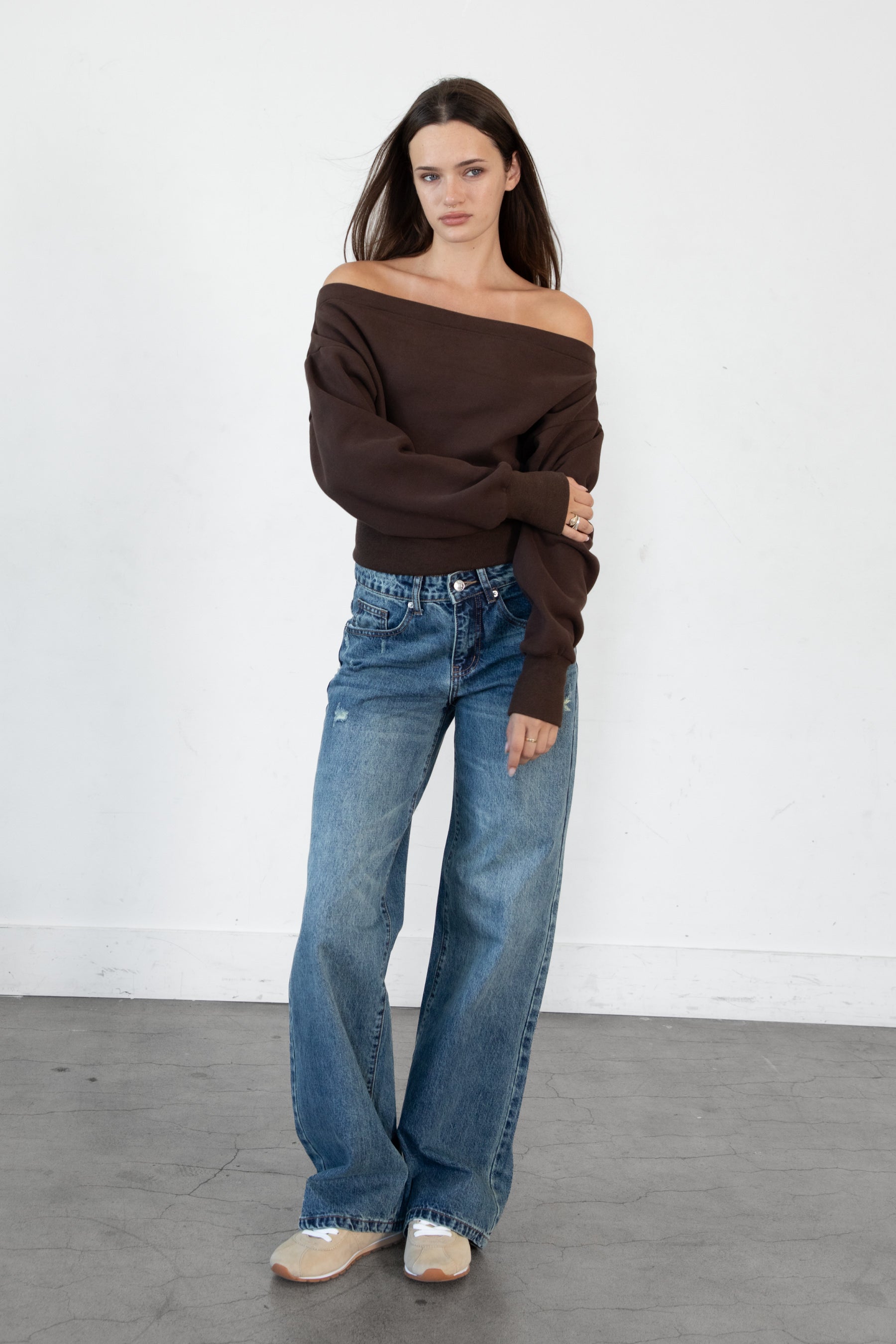Woman wearing LANI mock neck cloud fleece sweatshirt featuring soft cotton blend cloud fleece fabric, ribbed mock neckline, relaxed oversized fit, dropped shoulder design, long sleeves with ribbed cuffs, triangle stitch detail at center front, and ribbed hem for a cozy comfortable finish.
