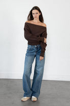 Woman wearing LANI mock neck cloud fleece sweatshirt featuring soft cotton blend cloud fleece fabric, ribbed mock neckline, relaxed oversized fit, dropped shoulder design, long sleeves with ribbed cuffs, triangle stitch detail at center front, and ribbed hem for a cozy comfortable finish.