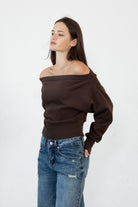 Woman wearing LANI mock neck cloud fleece sweatshirt featuring soft cotton blend cloud fleece fabric, ribbed mock neckline, relaxed oversized fit, dropped shoulder design, long sleeves with ribbed cuffs, triangle stitch detail at center front, and ribbed hem for a cozy comfortable finish.