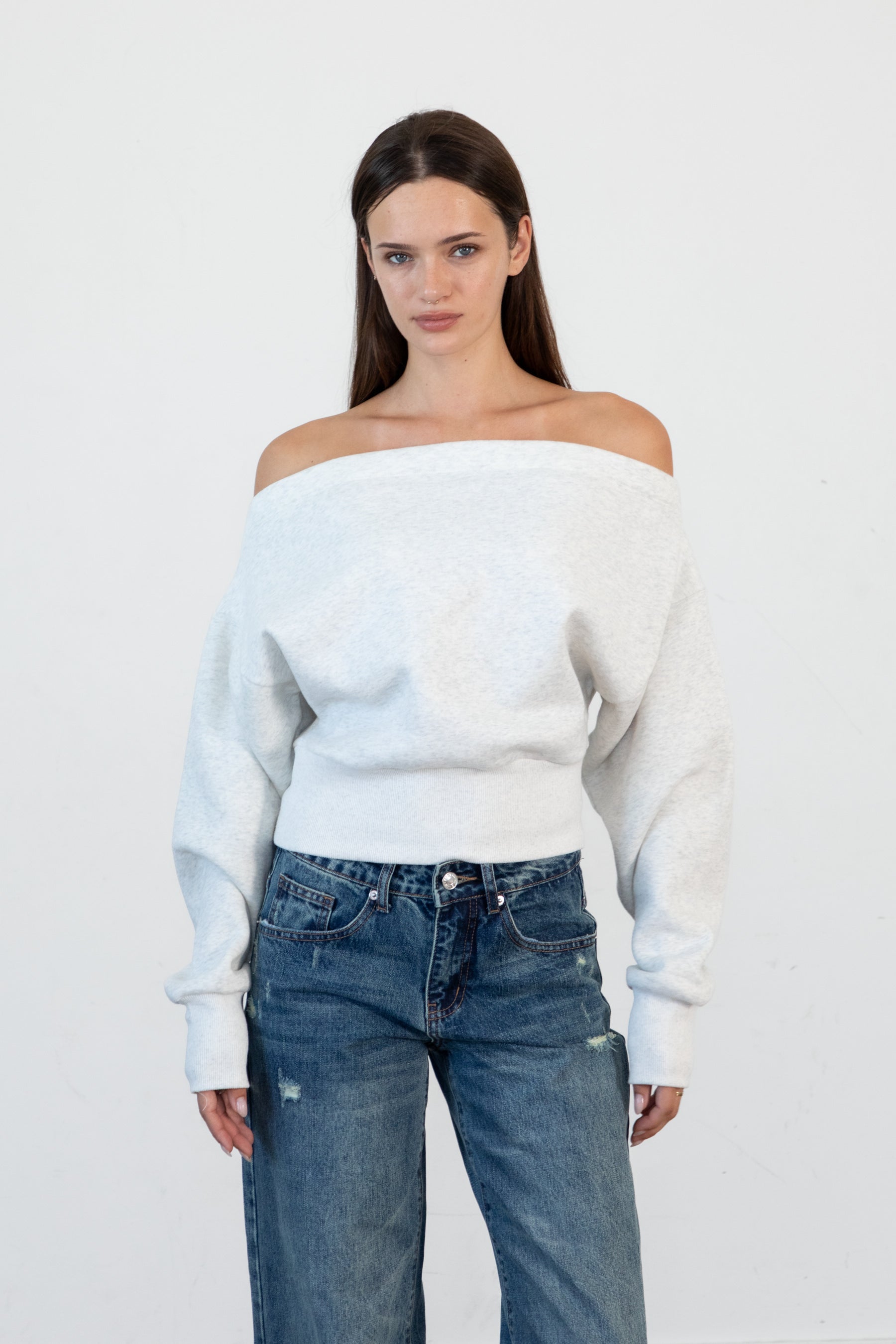 Woman wearing LANI mock neck cloud fleece sweatshirt featuring soft cotton blend cloud fleece fabric, ribbed mock neckline, relaxed oversized fit, dropped shoulder design, long sleeves with ribbed cuffs, triangle stitch detail at center front, and ribbed hem for a cozy comfortable finish.