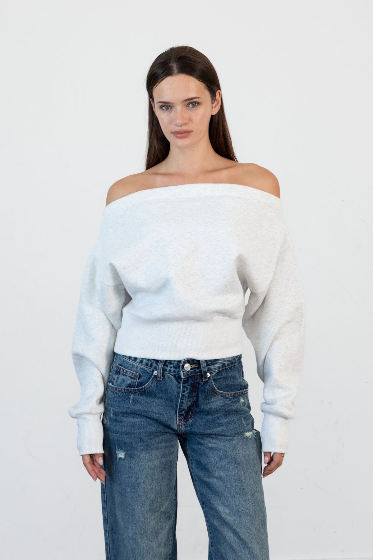 Woman wearing LANI mock neck cloud fleece sweatshirt featuring soft cotton blend cloud fleece fabric, ribbed mock neckline, relaxed oversized fit, dropped shoulder design, long sleeves with ribbed cuffs, triangle stitch detail at center front, and ribbed hem for a cozy comfortable finish.