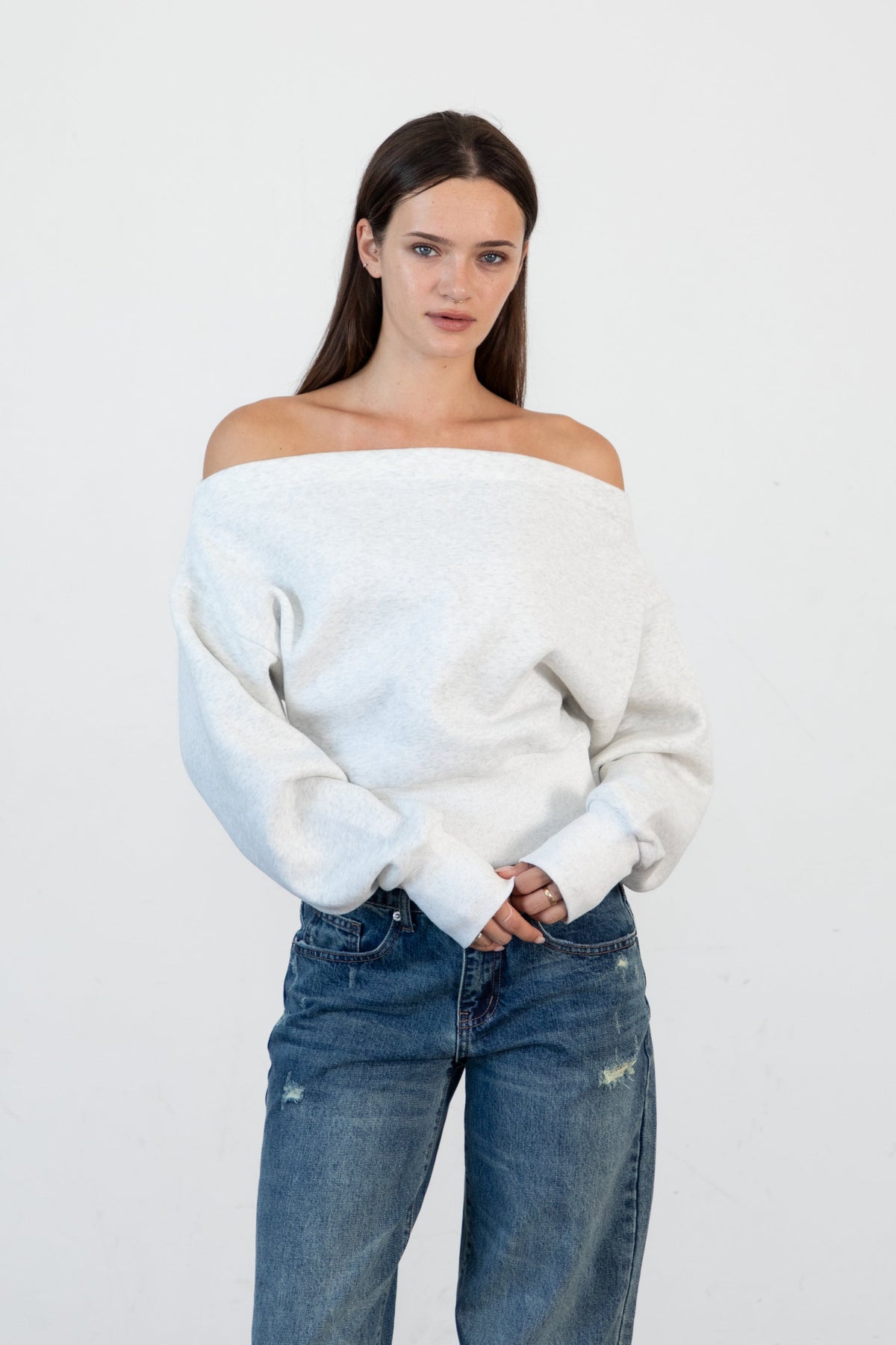 Woman wearing LANI mock neck cloud fleece sweatshirt featuring soft cotton blend cloud fleece fabric, ribbed mock neckline, relaxed oversized fit, dropped shoulder design, long sleeves with ribbed cuffs, triangle stitch detail at center front, and ribbed hem for a cozy comfortable finish.