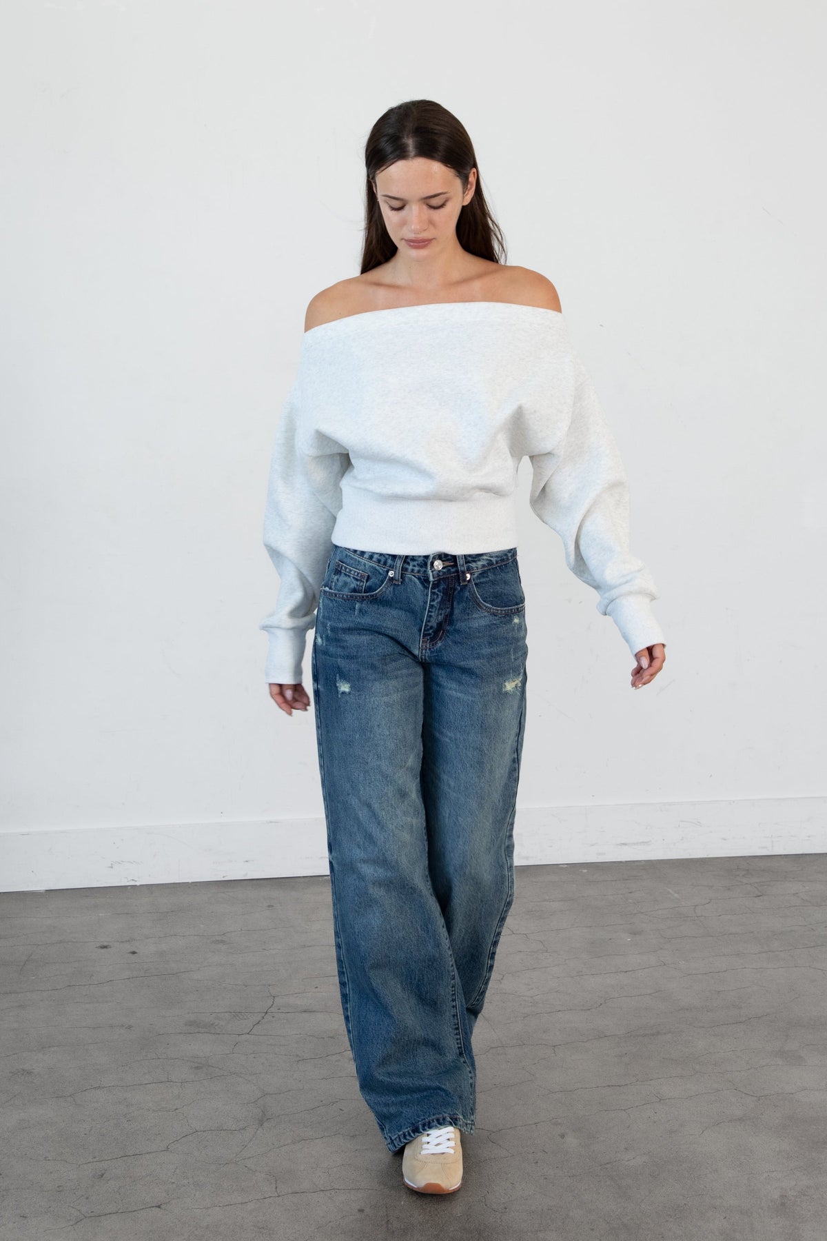 Woman wearing LANI mock neck cloud fleece sweatshirt featuring soft cotton blend cloud fleece fabric, ribbed mock neckline, relaxed oversized fit, dropped shoulder design, long sleeves with ribbed cuffs, triangle stitch detail at center front, and ribbed hem for a cozy comfortable finish.