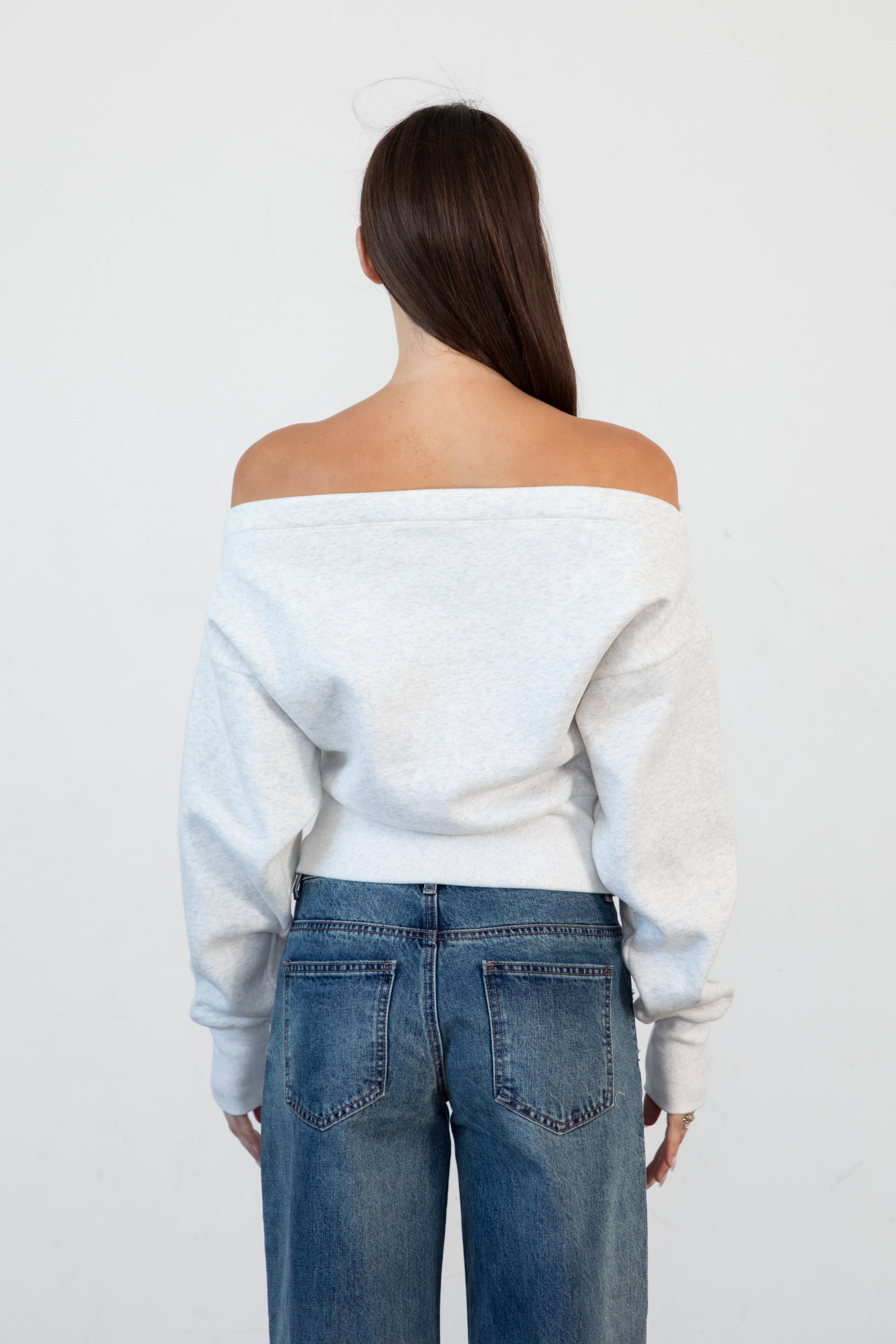 Woman wearing LANI mock neck cloud fleece sweatshirt featuring soft cotton blend cloud fleece fabric, ribbed mock neckline, relaxed oversized fit, dropped shoulder design, long sleeves with ribbed cuffs, triangle stitch detail at center front, and ribbed hem for a cozy comfortable finish.