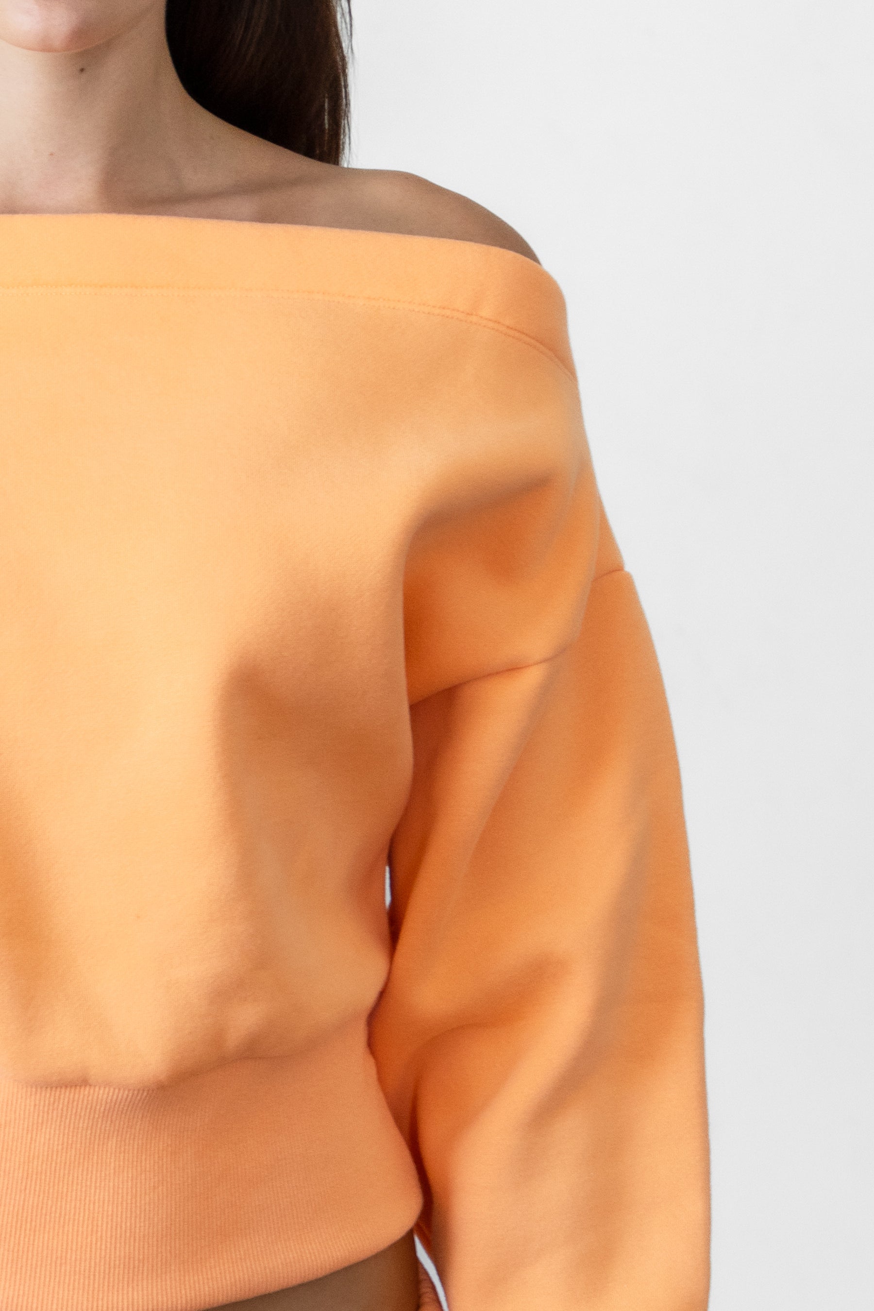 Woman wearing LANI mock neck cloud fleece sweatshirt featuring soft cotton blend cloud fleece fabric, ribbed mock neckline, relaxed oversized fit, dropped shoulder design, long sleeves with ribbed cuffs, triangle stitch detail at center front, and ribbed hem for a cozy comfortable finish.