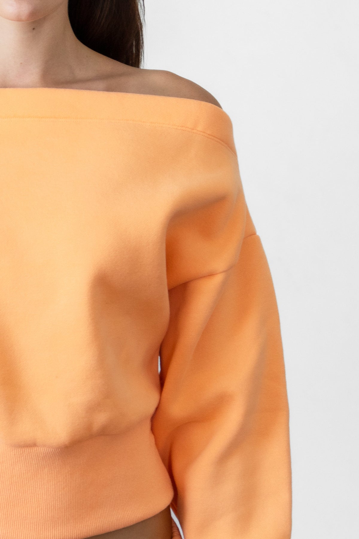 Woman wearing LANI mock neck cloud fleece sweatshirt featuring soft cotton blend cloud fleece fabric, ribbed mock neckline, relaxed oversized fit, dropped shoulder design, long sleeves with ribbed cuffs, triangle stitch detail at center front, and ribbed hem for a cozy comfortable finish.
