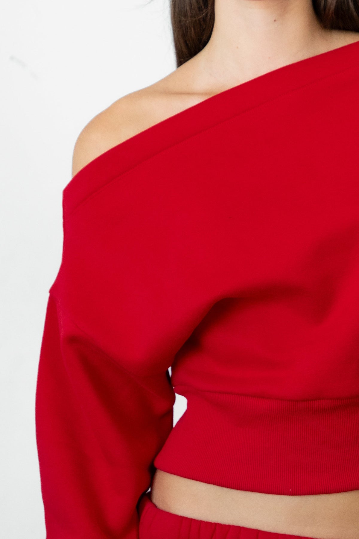 Woman wearing LANI mock neck cloud fleece sweatshirt featuring soft cotton blend cloud fleece fabric, ribbed mock neckline, relaxed oversized fit, dropped shoulder design, long sleeves with ribbed cuffs, triangle stitch detail at center front, and ribbed hem for a cozy comfortable finish.
