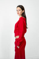 Woman wearing LANI mock neck cloud fleece sweatshirt featuring soft cotton blend cloud fleece fabric, ribbed mock neckline, relaxed oversized fit, dropped shoulder design, long sleeves with ribbed cuffs, triangle stitch detail at center front, and ribbed hem for a cozy comfortable finish.