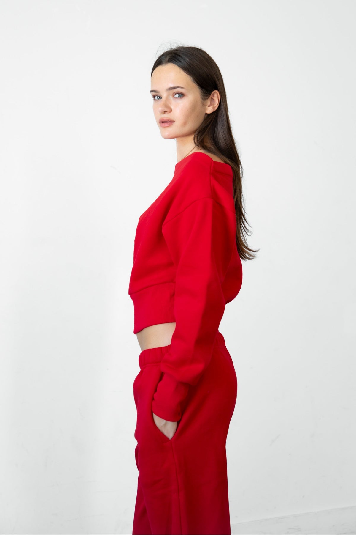 Woman wearing LANI mock neck cloud fleece sweatshirt featuring soft cotton blend cloud fleece fabric, ribbed mock neckline, relaxed oversized fit, dropped shoulder design, long sleeves with ribbed cuffs, triangle stitch detail at center front, and ribbed hem for a cozy comfortable finish.