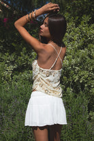 Woman wearing TIC TOC TL31684 AURYA chiffon sequin beaded cowl neck top featuring a draped cowl neckline, floral sequin and beaded embroidery, thin adjustable straps with cross back detail, fitted cropped silhouette, and asymmetrical hemline for a feminine festival and night-out look.