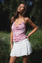 Woman wearing TIC TOC TL31684 AURYA chiffon sequin beaded cowl neck top featuring a draped cowl neckline, floral sequin and beaded embroidery, thin adjustable straps with cross back detail, fitted cropped silhouette, and asymmetrical hemline for a feminine festival and night-out look.