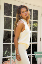 Woman wearing SONORA sweater knit one shoulder wide leg set featuring a soft stretch knit fabric, asymmetrical one shoulder sleeveless top, high-rise wide leg pants with stretch waistband, and a relaxed draped silhouette for a comfortable yet elevated look.