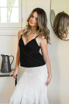 Woman wearing LEMONY cotton jersey lace trim cami top featuring a soft V-neckline with delicate ruffle trim, adjustable spaghetti straps, empire seam detail, and lightweight cotton jersey fabric with comfortable stretch for everyday layering and lounge styling.