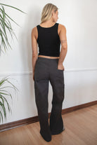 Woman wearing a black tank top and TIC TOC PH29257 ARROW charcoal twill carpenter cargo pants featuring multiple utility pockets and straight-leg fit.