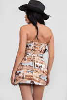 Woman wearing TIC TOC TA30526 DJANGO tapestry horse print strapless corset top with lace-up back and boned panel construction with a matching mini skirt. 