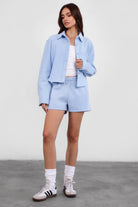 TIC TOC JENNIE cropped fleece shacket in baby blue with button-up front and front pocket detail