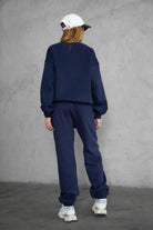 Game-day ready high-waist sweatpants in blush from the Essentials Plush Fleece Collection in navy