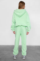 Game-day ready high-waist sweatpants in blush from the Essentials Plush Fleece Collection in pastel lime