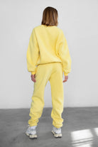 Game-day ready high-waist sweatpants in blush from the Essentials Plush Fleece Collection in yellow