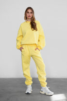 Game-day ready high-waist sweatpants in blush from the Essentials Plush Fleece Collection in yellow